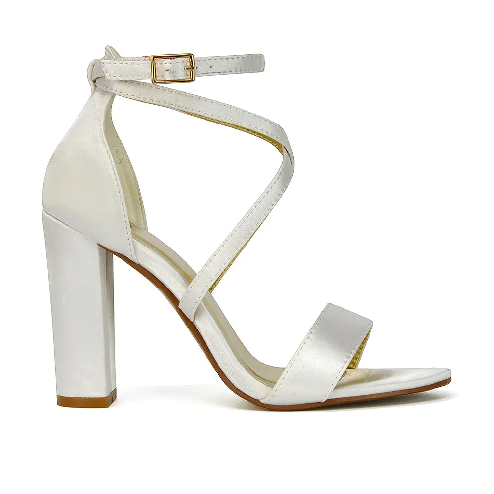 BRIELLA CROSS OVER FRONT STRAPPY BLOCK HIGH HEEL SANDALS IN IVORY SATIN